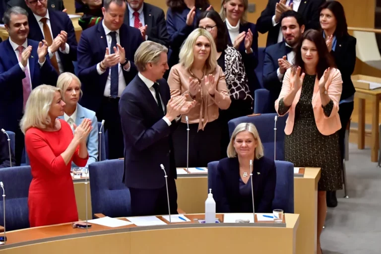 Magdalena Andersson is congratulated in the Swedish parliament on Monday after being reappointed as prime minister just days after quitting amid political turmoil.