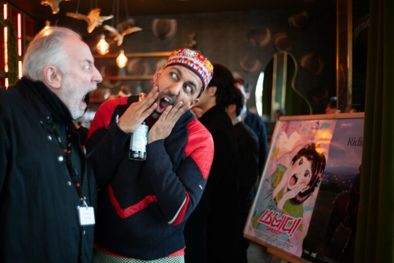 The directors of Whale 52 – Suite for Man, Boy, and Whale and Riding Time with the film poster of Speedy!